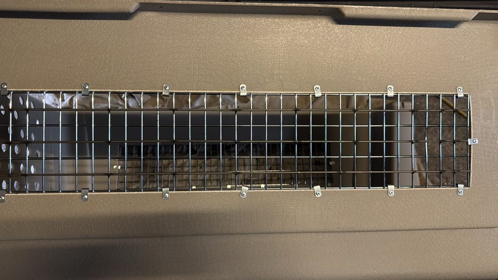 After: steel rods bolted across the slots to close the gaps